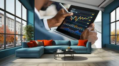 Corporate Executive Reviewing Market Analytics on Digital Tablet Wall mural