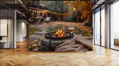 Cozy Autumn Garden Scene with Inviting Fire Pit  Warm Blankets  and Drinks for Relaxing Outdoor Moments Wall mural