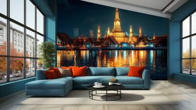 Illuminated Wat Arun Temple Reflecting on the Tranquil River in Bangkok Thailand Wall mural