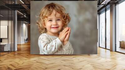 Joyful and Excited Child Clapping Hands Capturing the Essence of Childlike Wonder and Delight Wall mural