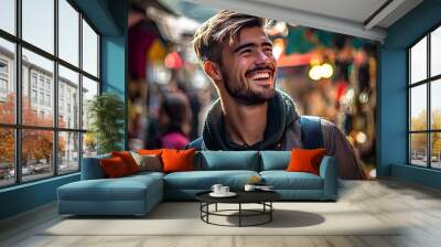 Joyful Laughter Captured in Candid Streetmarket Portrait of Handsome Young Man Wall mural