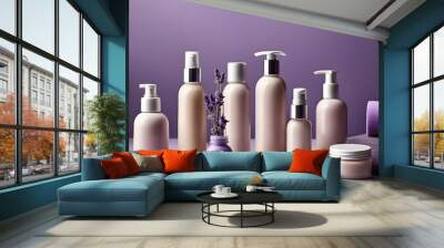 set of cosmetic products on a table: off white soft cream color shampoo bottles and cream containers with lavender decorations in a purple background Wall mural