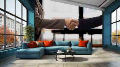 Businessmen and investors shake hands after attending  meeting with advisory team after receiving advice from  advisory team about jointly invested business. Businessmen Team handshake concept Wall mural