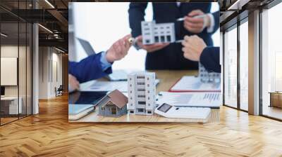 group of businessmen and investors discuss investing in real estate and jointly plan investments in construction projects of condominiums and apartments for sale and rent. investment advisory concept Wall mural