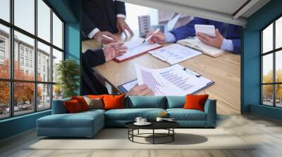 group of businessmen and investors discuss investing in real estate and jointly plan investments in construction projects of condominiums and apartments for sale and rent. investment advisory concept Wall mural