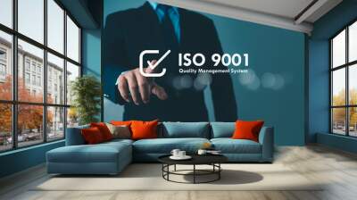 ISO 9001 Standard certification standardisation quality control concept. Businessman point your finger at text ISO 9001 for quality management of organizations, Certified and quality. Wall mural