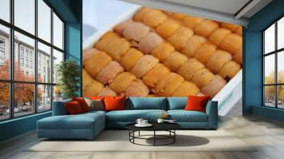 A box of uni sashimi on table served with soy sauce, Fresh sea urchin roe. Wall mural