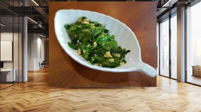 Stir-fried Baegu leaves with egg or Gnetum gnemon or Malindjo, Thai Southern traditional food style. Wall mural