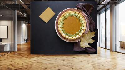 Homemade pumpkin pie with cinnamon on dark wooden background. Thanksgiving day concept. Top view. Copy space. Card with text Thank you. Wall mural