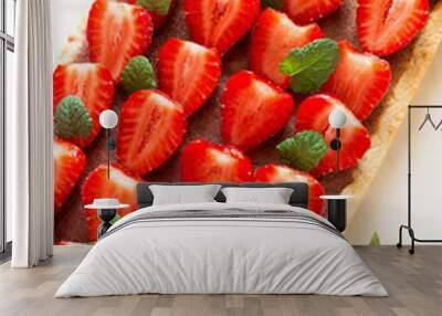 Homemade tart with strawberries and strawberry curd decorated mint leaves on white wooden background Wall mural