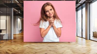 attractive smiling nice girl touching her chin looking at the camera, close up portrait, isolated pink background, studio shot Wall mural