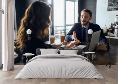 emotional bearded office worker having an argumnet with a woman.hardworking team working on project. close up photo Wall mural