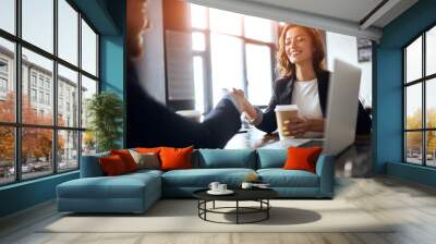 Two positive business people shaking hands indoors, close up photo. lifestyle, partnership concept. friendship Wall mural