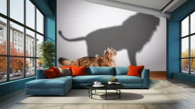 concept of hidden potential, cat and lion shadow. Wall mural