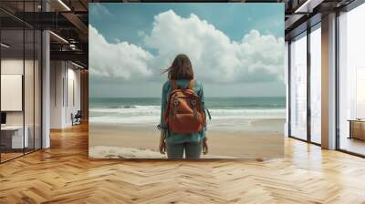 Back view of unrecognizable female traveler in casual clothes walking on sandy beach near waving sea against cloudy sky during vacation : Generative AI Wall mural