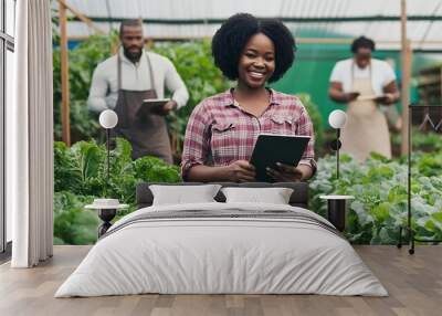 Beautiful African American organic vegetable garden owner with black skinStanding smiling holding tablet with team farmers Help take care of seed plots in the greenhouseModern Agricult : Generative AI Wall mural