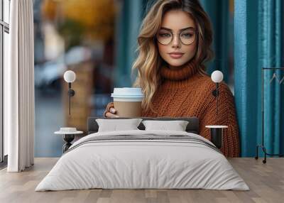 Beautiful woman wearing fall sweater ripped jeans and glasses drinking take away coffee standing against cafe wall on city street Casual fashion elegant everyday look Plus size model : Generative AI Wall mural