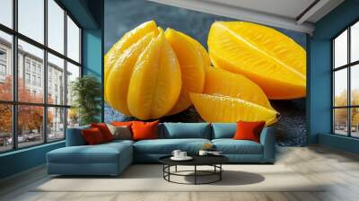 Carambola fruit isolated closeup Fresh ripe yellow fruits of Averrhoa carambola one fruit is whole and the other is sliced Sliced star fruit on a gray table background : Generative AI Wall mural