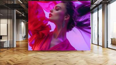 Dreaming woman young fashion model wearing fashionable silk red dress posing over violet neon background Banner for ad Concept of beauty fashion week sales human emotions trends : Generative AI Wall mural