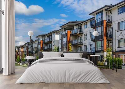 Exterior view of modern low rise apartment buildings complex with parking garages in an urban residential neighborhood : Generative AI Wall mural