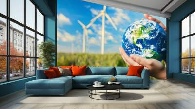 Generative AI : Hands holding earth, globe on wind turbine field against blue sky background.  Wall mural