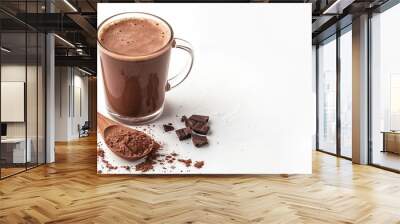 Glass of hot chocolate drink with cocoa powder in wooden spoon isolated on white background : Generative AI Wall mural