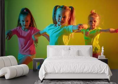 Group of children little girls in sportive casual style clothes dancing in choreography class isolated on green background in yellow neon light Concept of music  : Generative AI Wall mural