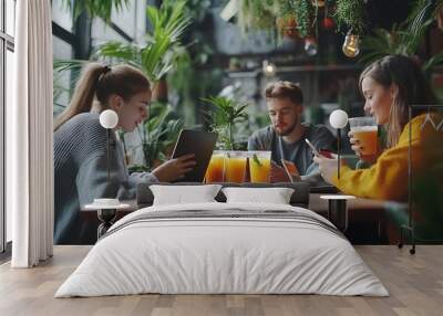 group of young people freelancer digital nomads sitting in cafe with tablet and laptop and cell phones while drinking juicy juices : Generative AI Wall mural