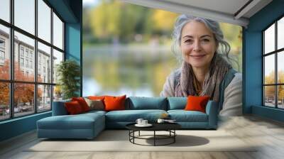 Lake portrait and smile with senior woman outdoor in garden for holiday retirement or vacation Chair nature and relax with happy elderly person sitting by water in park for chilling or : Generative AI Wall mural