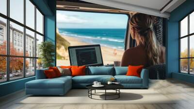 Living and working inside your camper while traveling and a digital nomadfree lifestyle A woman sitting in an RV enjoys relaxing and connecting to her laptop The beach in the backgroun : Generative AI Wall mural