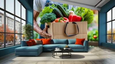 man holding a box of vegetables to be delivered to a customer. : Generative AI Wall mural