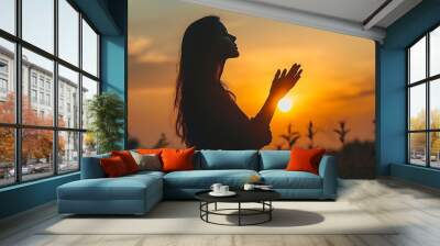 Silhouette of prayer woman worship God in the morning with sunrise sky background Person hands open palm up worship God helping repent catholic easter lent mind pray Christian religion : Generative AI Wall mural