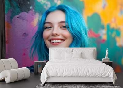 young woman with vibrant blue hair smiles joyfully against colorful background Wall mural