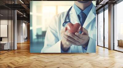 heart disease prevention concept. medical hands holding a heart with copy-space for text or advertis Wall mural