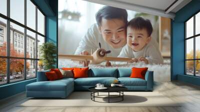 Asian dad and his cute little son playing with a wooden plane in a bright room, Generative AI Wall mural