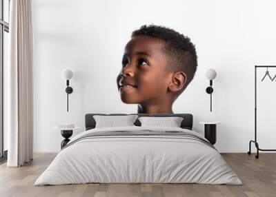 Portrait of a smiling African American kid looking up, happy little child isolated on white background Wall mural