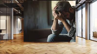 person sitting on the ground looking depressed Wall mural