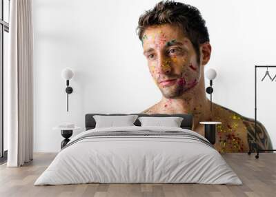 Handsome young man portrait, skin all painted with Holi colors Wall mural