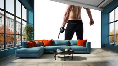 Muscular shirtless young man with whip and studded glove Wall mural