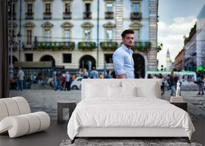 One handsome elegant man in city setting wearing shirt Wall mural