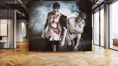 Two male zombies standing on black smoky background Wall mural