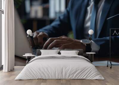 Businessman typing on laptop on desk in office. Realistic close-up photo for your design Wall mural