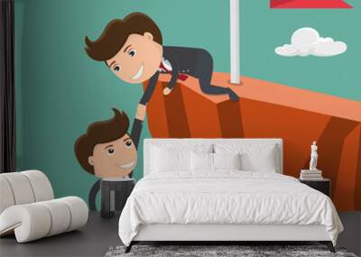 Businessman helping his friend pull up on the cliff. Vector illustration. Wall mural