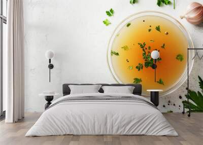 Soup in a glass bowl with gently floating ingredients Wall mural