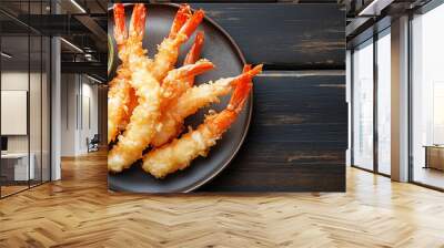 Tempura shrimp on a flat dish next to a small sauce bowl Wall mural