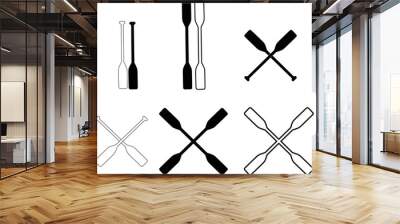 two black silhouette of crossed oars. rowing oars sign. crossed wood paddle symbol. flat style. Wall mural