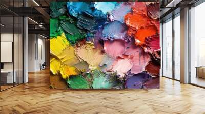 A colorful artist palette with smeared paints, illustrating the process of artistic creation. Wall mural