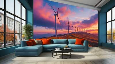 A row of wind turbines on a hill, set against the backdrop of a dramatic sunset sky, with rich colors creating a stunning visual impact. Wall mural