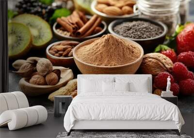 An assortment of organic ingredients, with maca powder displayed prominently among fresh fruits and nuts. Wall mural