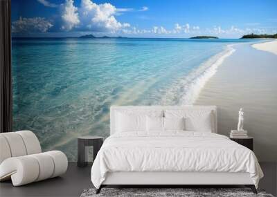 Crystal-clear ocean waters gently lapping against a white sandy beach on a sunny day. Wall mural